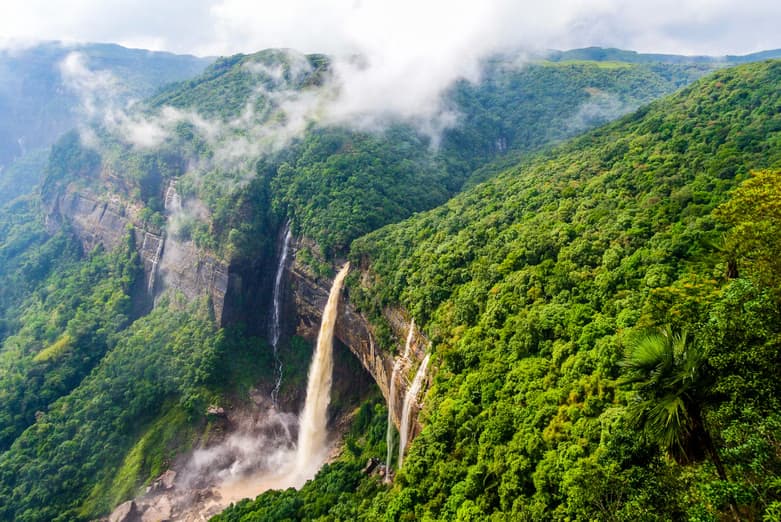 Seven Sisters Falls (Kynrem Falls) cascading down forested green cliffs near Cherrapunji, Meghalaya, in North East India