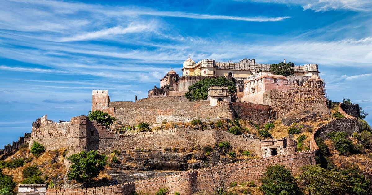 Chittorgarh Fort in Rajasthan showcasing historic Rajput architecture, ancient temples and fort walls surrounded by greenery