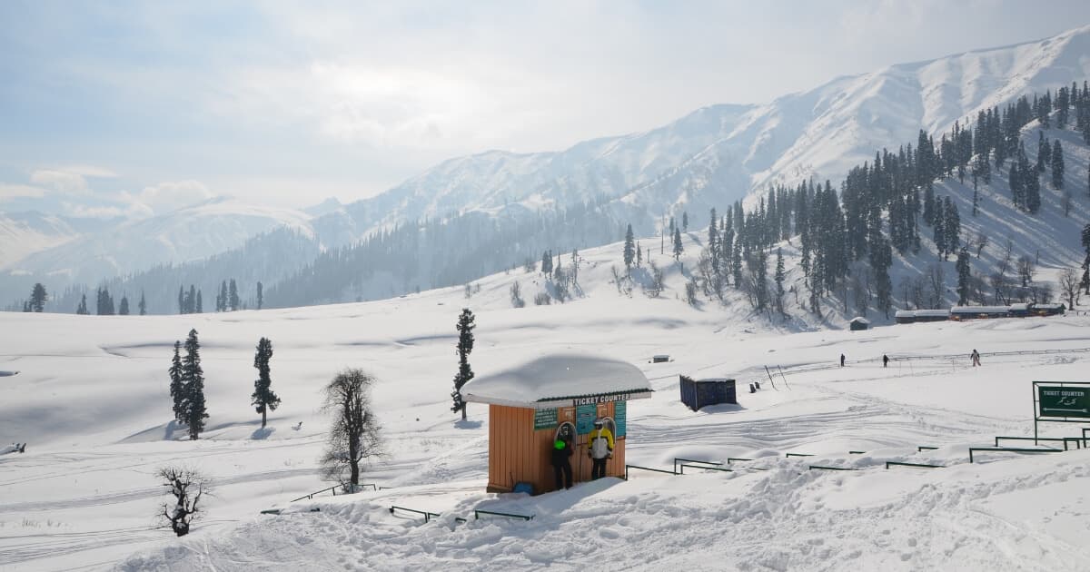 Gulmarg Kashmir covered in snow with majestic Himalayan mountains, pine forests and a winter landscape