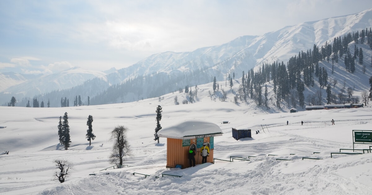 Gulmarg Kashmir covered in snow with majestic Himalayan mountains, pine forests and a winter landscape