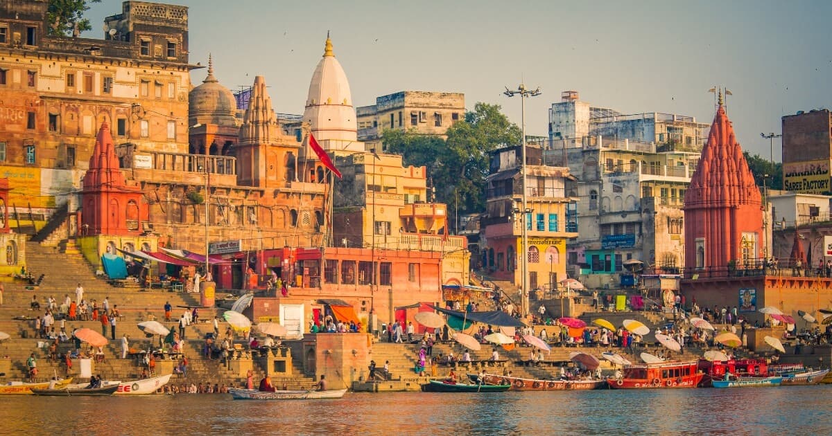 Varanasi ghats along the Ganges River with temples and boats in Uttar Pradesh