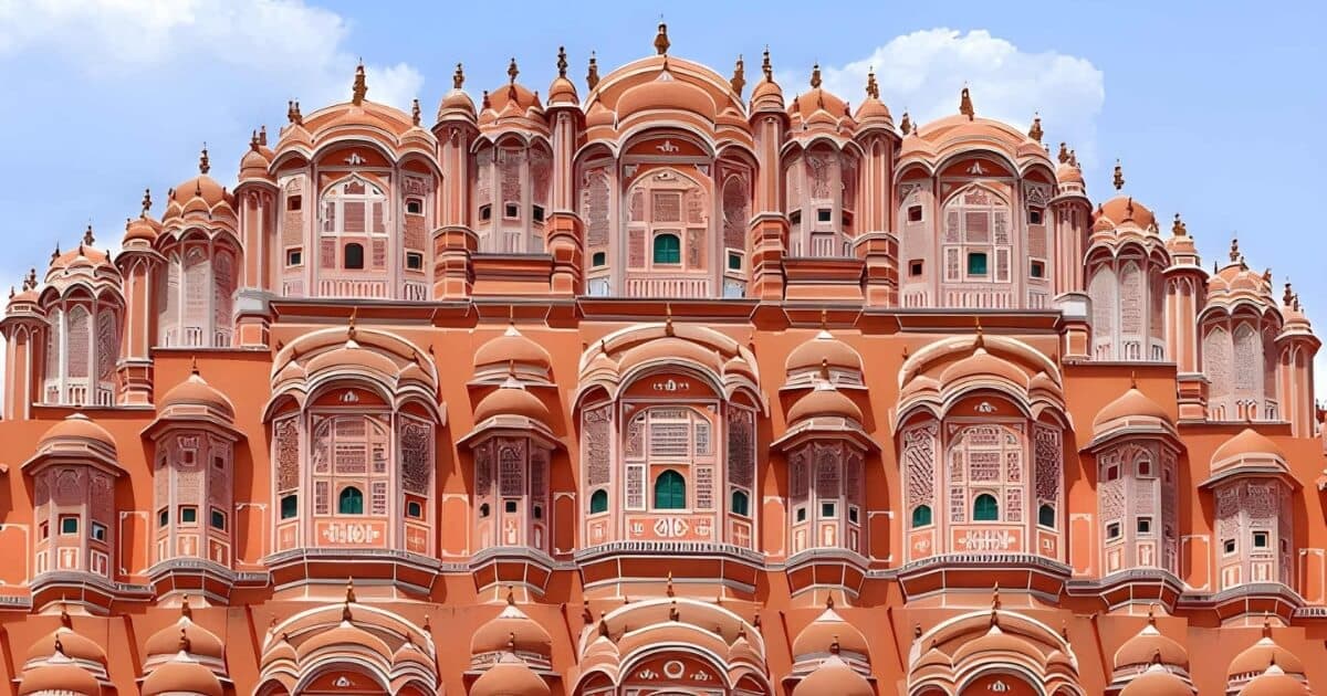 Iconic Hawa Mahal with ornate pink sandstone windows in Jaipur Rajasthan